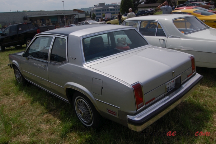 Oldsmobile Omega 3rd generation 1980-1984 (1980 Brougham Coupé 2d),  left rear view